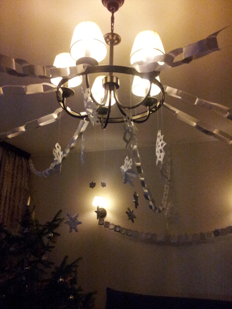 The children made paper chains and snowflakes to help decorate the flat